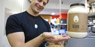 CEO Josh Tetrick holds a species of yellow pea used to make Just Mayo, a plant-based mayonnaise, at Hampton Creek Foods in San Francisco.